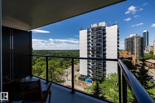 Stunning river valley views from the outdoor balcony featuring a glass and metal railing system - 807 10011 116 Street, Edmonton, AB 