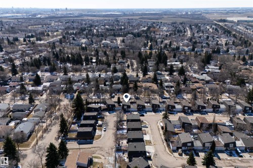 Aerial perspective showcasing a residential neighborhood with numerous homes and mature trees - 11 Greenfield Estates, St. Albert, AB 