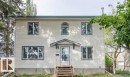 Two-story residence featuring light-toned horizontal siding with dark trim accents - 10948 75 Avenue, Edmonton, AB 