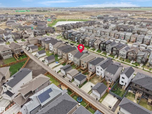 Aerial perspective showcasing a residential neighborhood with varied architectural styles - 5022 Kinney Link Sw, Edmonton, AB 