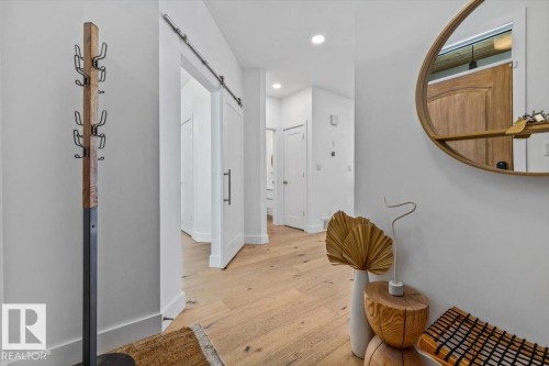 Hardwood flooring extending through the hallway - 10641 126 Street, Edmonton, AB 