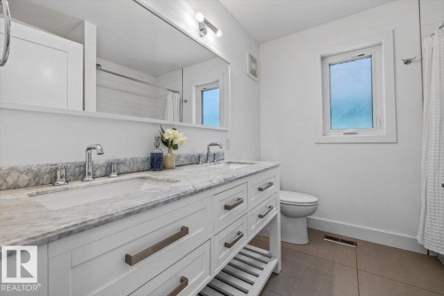 Dual vanity with stone countertop and integrated sinks - 10641 126 Street, Edmonton, AB 