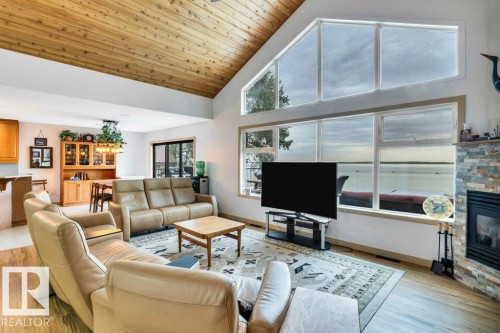 Large 2 level island with granite counters, stainless steel appliances, and subway tile backsplash - 275 Poplar Crescent, Rural Wetaskiwin County, AB - Indoor Photo Showing Kitchen