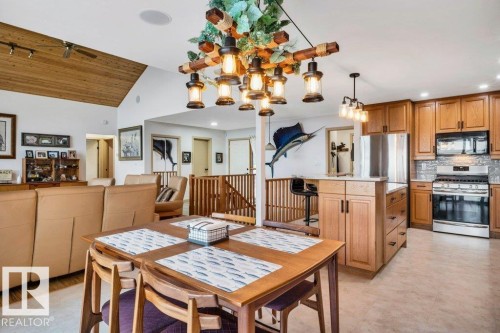 Expansive outdoor decking with Pigeon Lake for your  backdrop - 275 Poplar Crescent, Rural Wetaskiwin County, AB - Outdoor With Body Of Water With Deck Patio Veranda