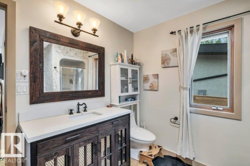 Main Floor room is a multi purpose space with access to 3 pce bath. Office? Studio? Oversized window for all day natural light - 275 Poplar Crescent, Rural Wetaskiwin County, AB - Indoor Photo Showing Bedroom