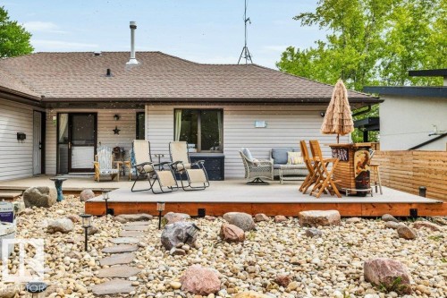 Spacious outdoor deck with a raised wood-finish surface - 275 Poplar Crescent, Rural Wetaskiwin County, AB - Outdoor With Deck Patio Veranda