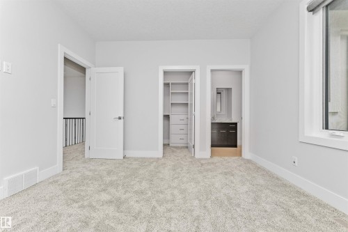 Neutral gray wall color complemented by light-toned carpeting - 3310 Watson Bay, Edmonton, AB 