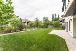 Expansive lawn area with a concrete patio - 
