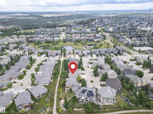 Expansive aerial perspective showcasing a residential neighborhood with varied architectural styles - 3310 Watson Bay, Edmonton, AB 