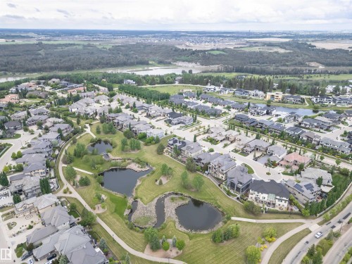 Residential community featuring diverse architectural styles, landscaped green spaces, and multiple water features - 3310 Watson Bay, Edmonton, AB 