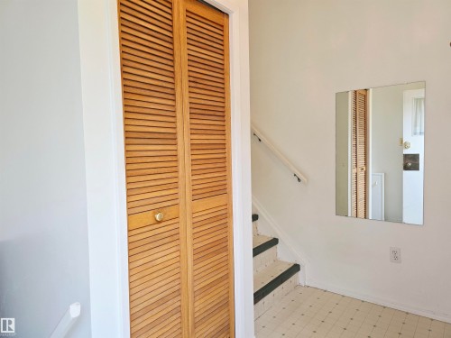 Entry from the back yard, stairs go up to the kitchen. - 66 Miller Avenue, Spruce Grove, AB 