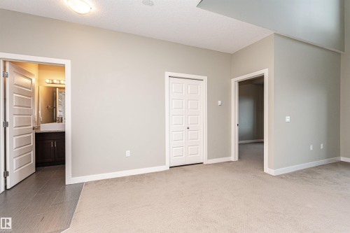 Spacious room featuring neutral carpeting and light-toned walls - 505 1230 Windermere Way, Edmonton, AB 