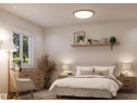 Neutral-toned bedroom featuring a picture window, recessed lighting, and a flush-mount ceiling fixture - 10919 106 Ave, Westlock, AB 