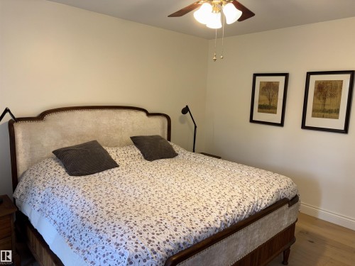 Room featuring light wood-finish flooring and neutral wall tones - 14016 85 Avenue, Edmonton, AB 