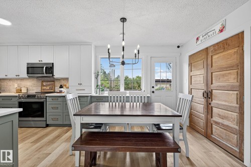 Bright dining area with door to deck and back yard - 9 Millgrove Drive, Spruce Grove, AB 