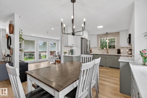 Dining room with door to deck - 9 Millgrove Drive, Spruce Grove, AB 