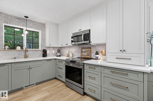 New custom-built kitchen with loads of drawers and cabinets with hidden drawers. - 9 Millgrove Drive, Spruce Grove, AB 
