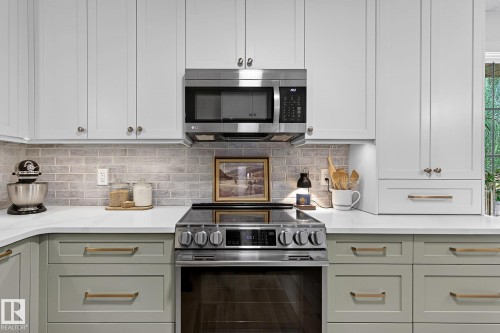 New custom-built kitchen with loads of drawers and cabinets with hidden drawers.  Majority of LG appliances 2 years old - 9 Millgrove Drive, Spruce Grove, AB 
