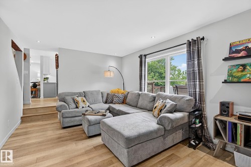 Main level family room with exterior sliding doors - 9 Millgrove Drive, Spruce Grove, AB 