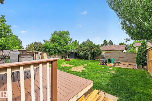 Expansive backyard featuring a with pressure treated deck - 9 Millgrove Drive, Spruce Grove, AB 
