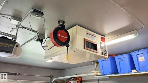 Garage ceiling featuring a forced-air heating unit - 9 Millgrove Drive, Spruce Grove, AB 