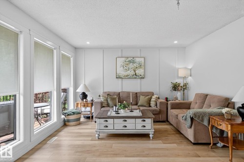 Bright open living room with new flooring - 9 Millgrove Drive, Spruce Grove, AB 