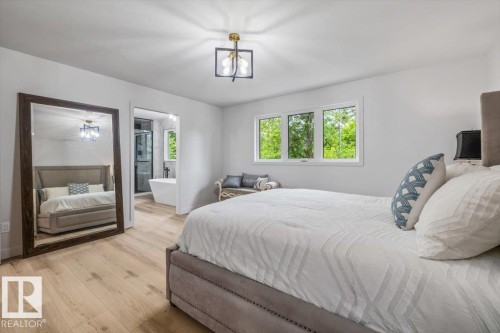 Bright interior space featuring light wood-finish flooring - 7 Glacier Place, St. Albert, AB 