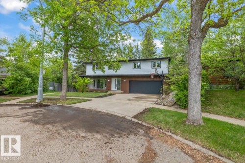 Contemporary two-story exterior with light blue and brown siding - 7 Glacier Place, St. Albert, AB 