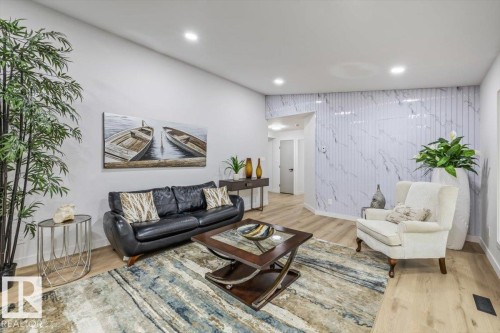 White marble-look accent wall featuring vertical fluting - 7 Glacier Place, St. Albert, AB 