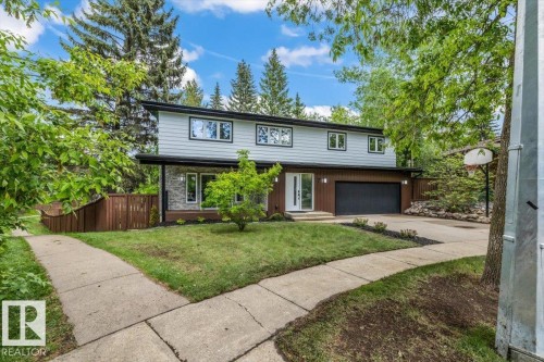 Contemporary two-story exterior with light gray siding and dark trim accents - 7 Glacier Place, St. Albert, AB 