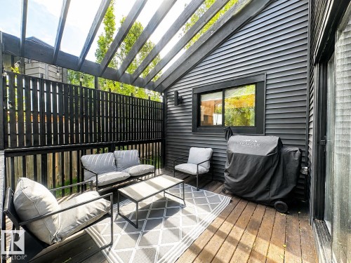 Outdoor deck featuring a wood pergola and privacy fence - 38 Woodcrest Avenue, St. Albert, AB 