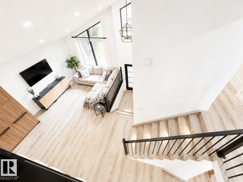 Soaring ceilings with a large triangular window create a bright living space - 38 Woodcrest Avenue, St. Albert, AB 