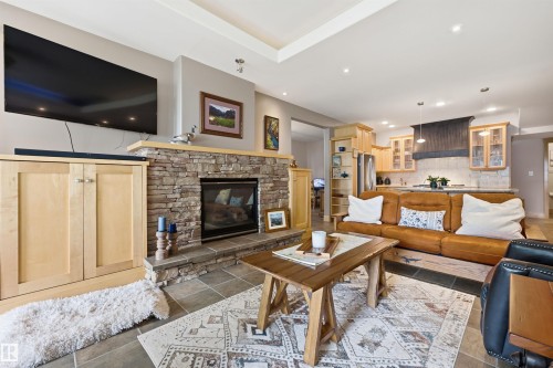 Stone-faced fireplace with a hearth - A38 Bernice Ave, Rural Leduc County, AB 