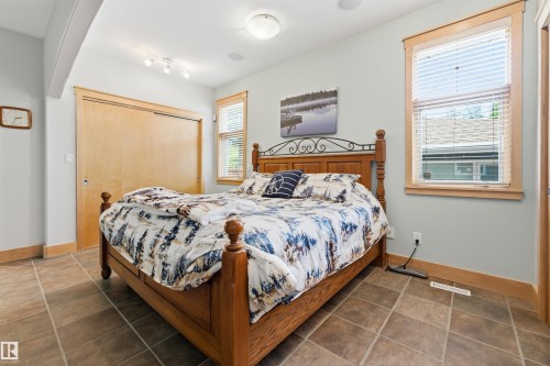 Bedroom with tile flooring and light-toned walls - A38 Bernice Ave, Rural Leduc County, AB 