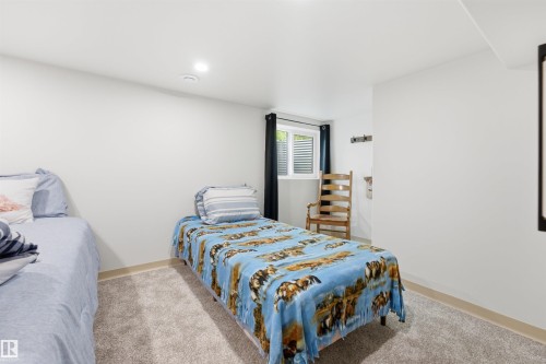 Room featuring light gray carpet flooring and white painted walls - A38 Bernice Ave, Rural Leduc County, AB 