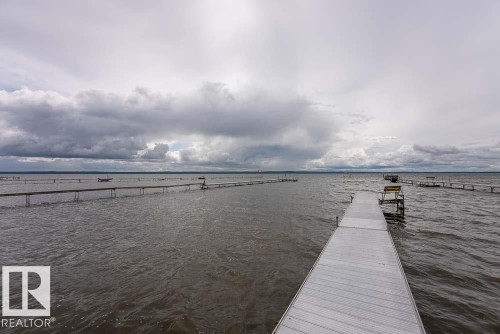 Expansive water frontage featuring multiple private dock structures - A38 Bernice Ave, Rural Leduc County, AB 