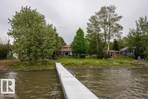 Long aluminum dock extending over water - A38 Bernice Ave, Rural Leduc County, AB 