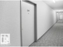Entry door with unit number 207, set within a long corridor featuring white textured walls, recessed baseboards, and patterned carpet flooring - 107 10023 164St, Edmonton, AB 