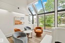 Sunroom featuring soaring ceilings and expansive glass panels - 115 4608 52 Avenue, Stony Plain, AB 