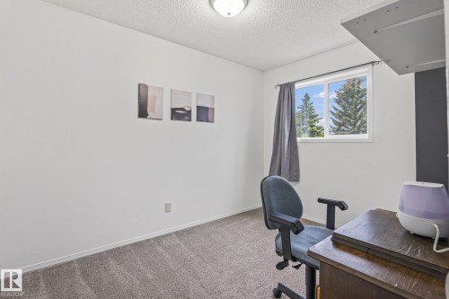 Bright room featuring white walls and a window with white trim - 128 Brookview Wy, Stony Plain, AB 