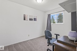 Bright room featuring white walls and a window with white trim - 