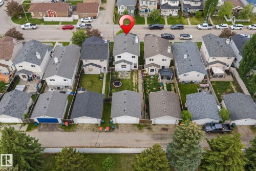 Two-story residence featuring light-colored siding and a dark-toned shingle roof - 128 Brookview Wy, Stony Plain, AB 