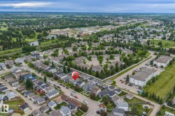 Aerial perspective showcasing a residential neighborhood with green spaces and infrastructure - 