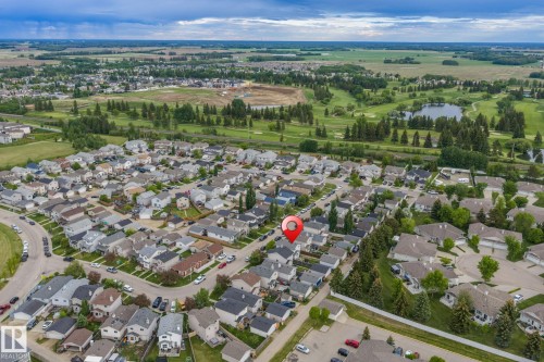 Aerial perspective showcasing a residential neighborhood with varied housing styles - 128 Brookview Wy, Stony Plain, AB 