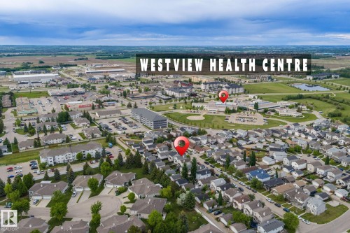 Aerial overview of a residential neighborhood with varied housing styles - 128 Brookview Wy, Stony Plain, AB 