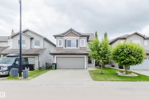 Modern two-story home featuring a combination siding exterior - 21223 58 Avenue, Edmonton, AB 