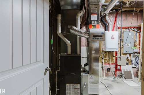 Mechanical room featuring a furnace, water heater, and a humidifier - 21223 58 Avenue, Edmonton, AB 