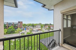Balcony featuring a black metal railing and stucco exterior - 