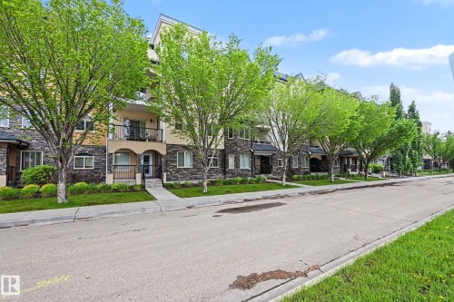 Multi-story building exterior featuring stone and stucco accents - 402 8730 82 Avenue, Edmonton, AB 