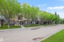 Multi-story building exterior featuring stone and stucco accents - 402 8730 82 Avenue, Edmonton, AB 